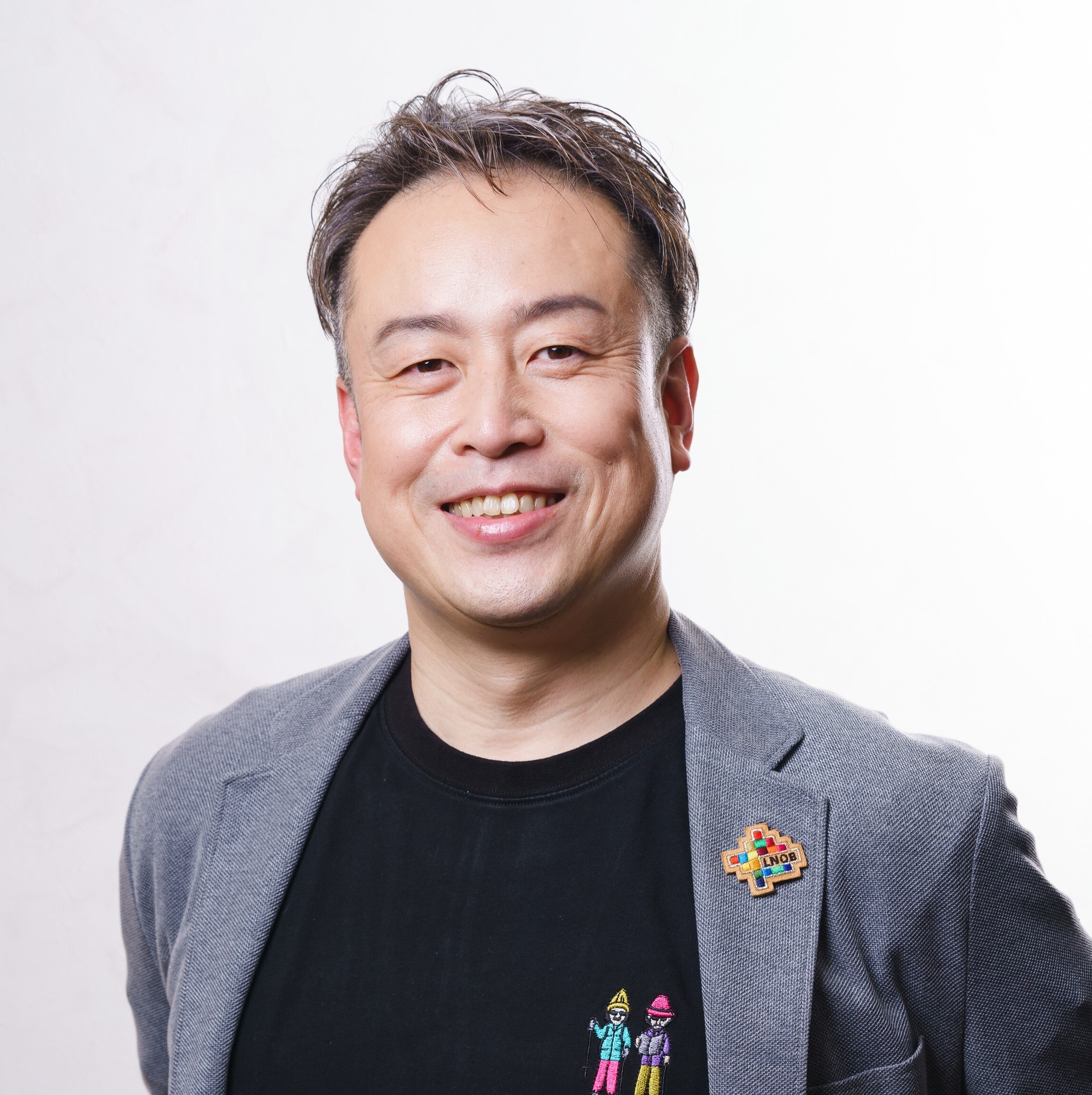 一般社団法人サステナブルコミュニティ共創機構代表理事の横山泰治氏の写真。本ワークショップにて講師を務めていただきます。